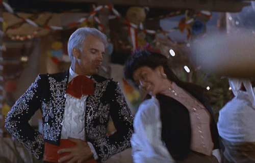 Three Amigos: Lucky and Carmen (Patrice Martinez) dancing in celebration.