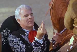 Three Amigos: Lucky confirms a hunch about one of the shooters' guns.