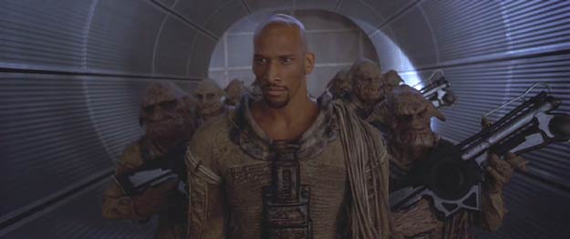 The Fifth Element: The Mangalore Aknot, in human form (played by Vladimir McCrary), and his soldiers are on their way to make a business deal.