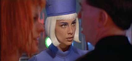 The Fifth Element: LeeLoo and David checking in at the airport (Sophia Goth as the attendant.)