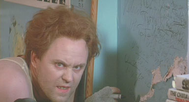The Adventures of Buckaroo Banzai Across the 8th Dimension: Lord John Whorfin working on his overthruster in the asylum.