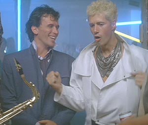 The Adventures of Buckaroo Banzai Across the 8th Dimension: Buckaroo Banzai, rock star, neurosurgeon, comic book hero, samurai and scientist and his best friend, Perfect Tommy, warming up for a show.
