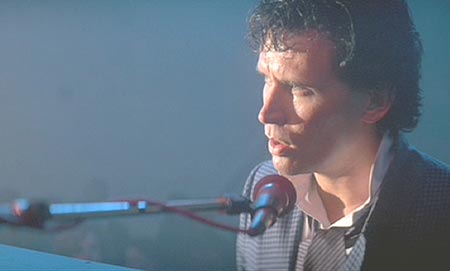 The Adventures of Buckaroo Banzai Across the 8th Dimension: Touched by Penny's depression, Buckaroo sings something special just for her.
