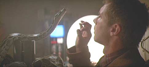 Blade Runner: Deckard examines the artificial serpant.