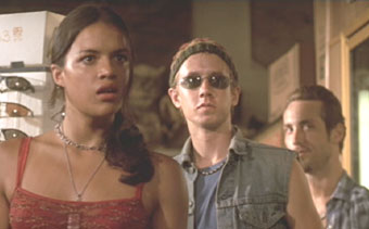 The Fast and the Furious: Letty, Jesse (Chad Lindberg) and Leon (Johnny Strong) look on as Dom goes after Vince.