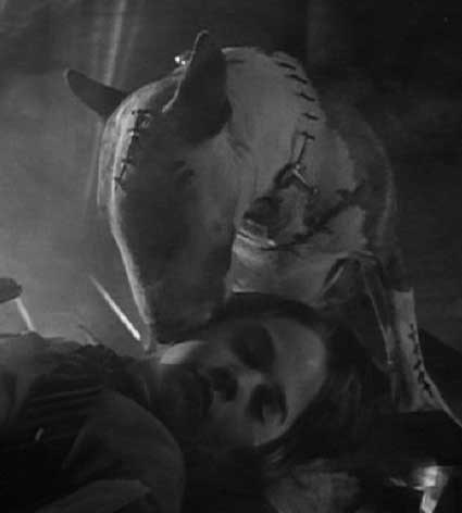 Frankenweenie: Sparky licking the unconscious Victor in the burning windmill.