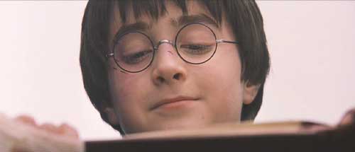 Harry Potter and the Sorcerer's Stone: Harry's been given a family portrait.