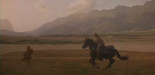 Ladyhawke: Phillipe gallops toward Imperius' castle with the wounded hawk.