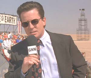 Mars Attacks: Nathalie's boyfriend, GNN reporter Jason Stone, covering the Martian landing.