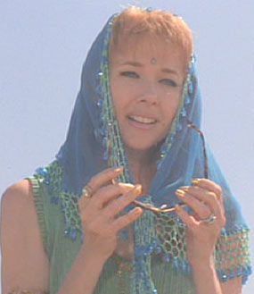 Mars Attacks: Art's wife, Barbara, believes the Martians have come to save the people of earth.