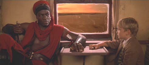 The Mummy Returns: Lock-Nah (Adewale Akinnuoye-Agbaje) and Alex (Freddie Boath) have a complicated relationship.