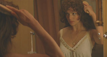 The Mummy (1999): Evie brushes her hair before bed, little knowing she is about to be attacked.