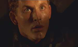 Pitch Black: Immediately after the crash, bounty hunter William Johns discovers he's missing his cargo.