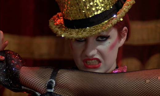 The Rocky Horror Picture Show: "… or maybe, a bite… " Is there a leg in the world that is not improved by fishnet stockings?
