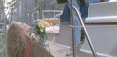 Romancing the Stone: Jack welcomes Joan aboard the Angelina Columbia.