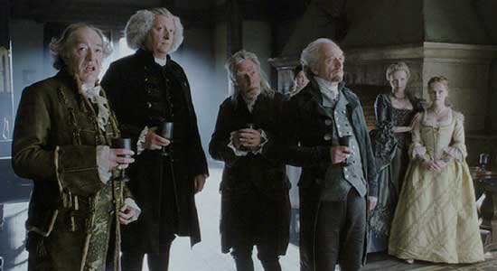 Sleepy Hollow: Baltus Van Tassel, Reverend Steenwyck, Notary Hardenbrook, Dr. Lancaster, and Lady and Katrina Van Tassel transfixed by the idea of Ichabod pitting himself against the Hessian Horseman.