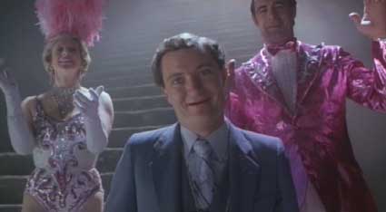 Time Bandits: The ubiquitous gameshow host tempting people with his money and prizes, flanked by Kevin's coldly materialistic parents (played by Sheila Fearn and David Daker.)