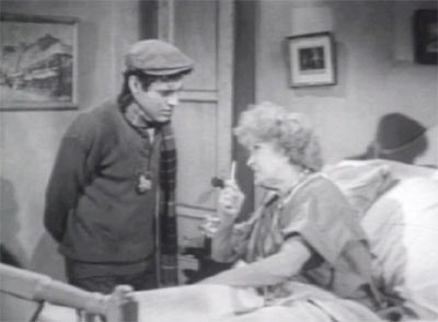The Little Shop of Horrors (1960): Seymour Krelboyne (Jonathan Haze) and his hilarious mother, Winifred, played by (Myrtle Vail).