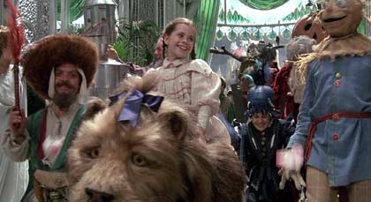 Return to Oz: The restored citzens of the Emerald City celebrate Dorothy's victory. Notice the Cowardly Lion and the Tin Woodsman make an appearance.