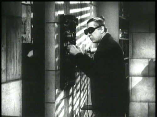 The Devil Bat: Carruthers in his lab, exposing his bat to something—radiation?—that causes it to grow.