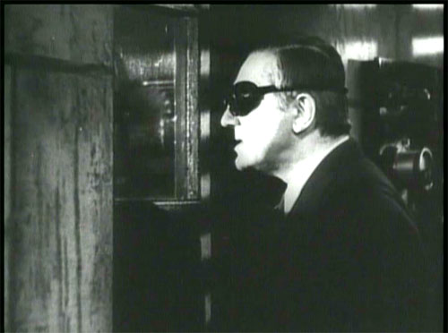 The Devil Bat: Carruthers observes the effect of his hidious experiment.