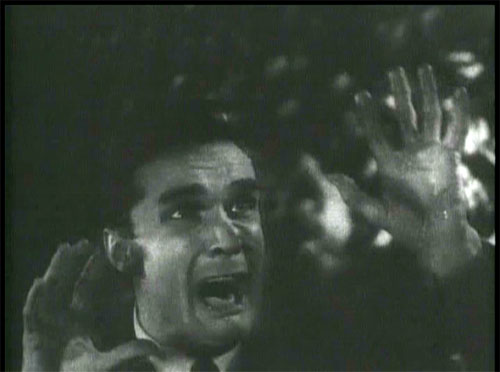 The Devil Bat: Roy Heath (John Ellis) is attacked by the bat.